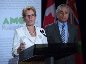 Ontario Premier Kathleen Wynne (left) speaks to the media during a press conference with Ontario Minister of Municipal Affairs Bill Mauro at the Associations of Municipalities Ontario Conference at Caesars Windsor August 15.(Photo taken by Justin Prince)