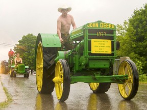 James Kuik leads the Lucknow tractor parade on Saturday, Aug. 13, 2016 astride one of his grandfather John Kuik’s old John Deere tractors. A total of 51 tractors were out on the day. (Darryl Coote/Reporter)