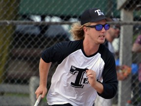 As part of the 34-team Mitchell Grizzlies men's slo-pitch tournament at Keterson Park last weekend, Zane Walkom (left) of The Team, comprised mostly of Mitchell and area players, hustles down the line during opening night action against Team Clapp, comprised of players from Stratford and area. GALEN SIMMONS MITCHELL ADVOCATE