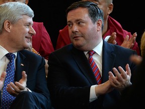 Conservative Leader Stephen Harper speaks with Conservative candidate Jason Kenney as he makes a campaign stop in Markham, Ontario, on Monday, Aug. 10, 2015. THE CANADIAN PRESS/Sean Kilpatrick