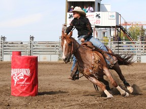 Nikki Vanderlee, from Stettler, AB, competes in the women’s barrel racing Saturday at the Sid Hartung Memorial Rodeo.