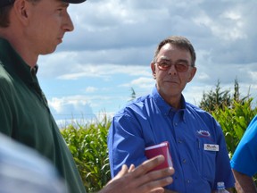 Ron Faubert, right, President of the Kent Federation of Agriculture, listens to a presentation by Jeff VanRoboys at The Pickle Station. Located just north of Chatham, The Pickle Station was one of three stops made on the first day of the OFA's Summer Tour in Chatham-Kent.