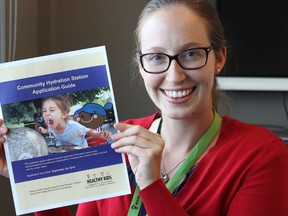 Samantha Reed/The Intelligencer
Emma Pillsworth, local project manager for the Healthy Kids Community Challenge, holds up an application for the 
The Hastings Prince Edward Public Health’s newest initiative at the health unit Monday afternoon. Government Funded and non-profit organizations can now apply for new hydration stations to be installed or upgraded in their facilities as part of an initiative to get kids to drink more water.