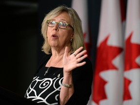 Green Party Leader Elizabeth May gestures as she makes an announcement at the National Press Theatre, in Ottawa on Monday, August 22, 2016. THE CANADIAN PRESS/Justin Tang