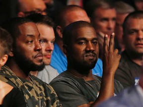 Kanye West gestures while attending UFC 202 on Saturday, Aug. 20, 2016, in Las Vegas. (AP Photo/Isaac Brekken)