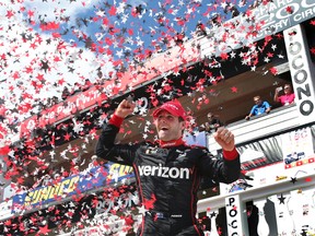 Will Power celebrates in Victory Lane after winning the Pocono IndyCar 500 auto race Monday, Aug. 22, 2016, in Long Pond, Pa. (AP Photo/Mel Evans)