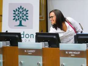 A smiling Ward 5 councillor Maureen Cassidy is greeted by other councillors as she returned to work at city hall in London, Ont. on Monday August 22, 2016. Cassidy attended the civic works committee meeting in council chambers. (MIKE HENSEN, The London Free Press)