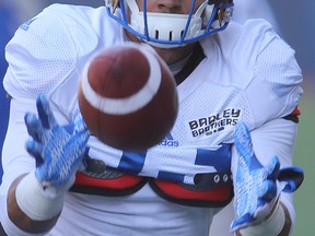 Winnipeg Blue Bombers running back Andrew Harris goes for a pass during CFL football practice in Winnipeg, Man. Monday August 22, 2016.