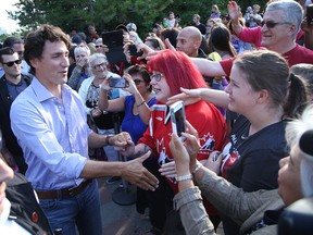 Prime Minister Justin Trudeau greets well-wishers at a community barbecue on Monday. Trudeau and his ministers wrapped up a two-day cabinet retreat in Sudbury at Laurentian University. (Gino Donato/Sudbury Star)