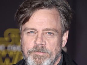 In this Dec. 14, 2015 file photo, Mark Hamill arrives at the world premiere of "Star Wars: The Force Awakens" in Los Angeles. Hamill is lending his support to a terminally ill fan who wants to see "Rogue One: A Star Wars Story" before he dies. Illustrator Neil Hanvey from Oldham, England, was informed by doctors in April that he has six to eight months to live. "Rogue One" is set for release Dec. 16. (Photo by Jordan Strauss/Invision/AP, File)