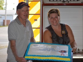 Findlay Barr and Theresa Tremblay display the huge cake that was available for dessert.