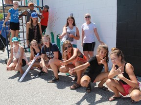 A group of teenage artists take a breather while making a mural at 175 Exmouth St. on a hot August afternoon. The teenagers were participating in the Judith & Norman Alix Art Gallery's  Random Acts of Art Workshop.
CARL HNATYSHYN/SARNIA THIS WEEK