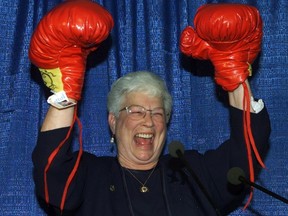 Conservative candidate for Saint John, Elsie Wayne, raises her hands after receiving a pair of boxing gloves from a man dressed in a blue Santa suit during her nomination meeting in Saint John, N.B., on Oct. 23, 2000. Wayne, the former mayor of Saint John who was one of only two Conservative MP's left standing in the 1993 federal election, has died. (THE CANADIAN PRESS/Jacques Boissinot)