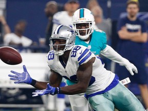 Dallas Cowboys wide receiver Dez Bryant (88) reaches out to catch a pass in front of Miami Dolphins defensive back Byron Maxwell during a NFL preseason game Friday, Aug. 19, 2016, in Arlington, Tex. (AP Photo/Michael Ainsworth)