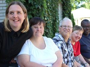 Samantha Reed/The Intelligencer
Front to back, Amy, Janet, Mark, Monique and Arneil of the Continuing On In Education program sit on a bench outside of the program's office on William Street in Belleville Tuesday morning. The program will be hosting its annual Walk for Inclusion at Zwicks Park on Saturday.