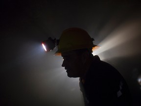 A worker works inside Simon Bolivar gold mine, legally developed by the firm Rusoro Mining in El Callao in the southern Bolivar State in this July 14, 2010 file photo. (REUTERS/Carlos Garcia Rawlins/Files)