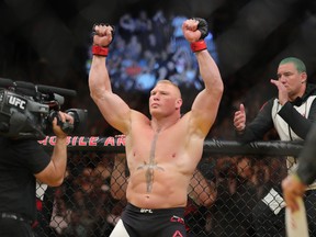 Brock Lesnar raises his arms before facing Mark Hunt during the UFC 200 event at T-Mobile Arena in Las Vegas on July 9, 2016. (Rey Del Rio/Getty Images)