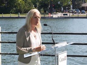 Minister of Environment Catherine McKenna makes a funding announcement with Mayor Jim Watson next to the Rideau Canal in Ottawa on Tuesday, August 23, 2016.(Patrick Doyle)