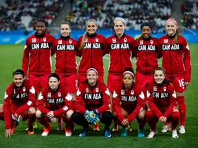 Players on Canada's women's soccer team pose before their match against France at the Rio Summer Games on Aug. 12. (GETTY IMAGES)
