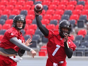 Redblacks quarterbacks Trevor Harris (left) and Henry Burris. (Jean Levac, Postmedia Network)