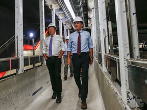 Toronto Mayor John Tory (left) and Finance Minister Bill Morneau check out a new elevator that is being installed at  the St. Clair subway station on Aug. 23. (DAVE THOMAS, Toronto Sun)