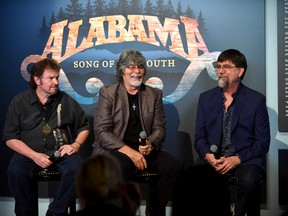 Jeff Cook, Randy Owen, and Teddy Gentry of the band Alabama speak during the debut of the "Alabama: Song of the South" exhibition at Country Music Hall of Fame and Museum on August 22, 2016 in Nashville, Tennessee.  (Photo by Jason Davis/Getty Images for Country Music Hall of Fame & Museum)