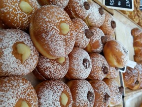Amico Chef Bakery offers a great variety of goodies including pizza and yummy doughnuts.