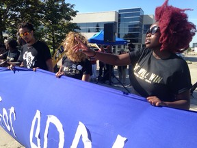 Black Lives Matter Toronto protests outside the Special Investigations Unit headquarters on Commerce Blvd. in Mississauga on Aug. 24, 2016. (Terry Davidson/Toronto Sun)