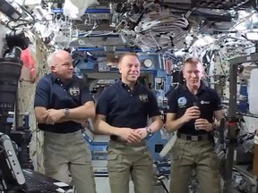 In this image made from video provided by NASA, from left, NASA astronauts Jeffrey Williams and Timothy Kopra, and British astronaut Timothy Peake participate in an interview from the International Space Station on Thursday, April 14, 2016. Williams, commander of the International Space Station, marked his 521st day in orbit Wednesday, breaking the U.S. record for the most time spent in space. (NASA via AP)