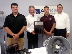 Ursuline College Chatham's Austin O'Brien-Nordstrom, left, and Wallaceburg District Secondary School's Trevor Bogaert, second from right, are the first two recipients of the AarKel manufacturing technology award. AarKel's Tony Myers, second from left, and Larry Deleay presented the award, which will go annually to the top technology student at both UCC and WDSS. Both O'Brien-Nordstrom and Bogaert received a plaque and $250. If the recipients become machinists at AarKel after they graduate from post-secondary studies, they will receive up to $1,000 for a tooling allowance. Additionally, AarKel will assist the award winners with their apprenticeship costs and travel.