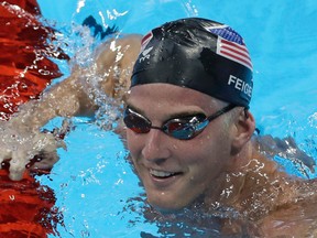 U.S. swimmer James Feigen apologized for the "serious distraction" he and three teammates caused at a gas station during the Rio Olympics, saying he omitted facts in his statement to police. (Matt Slocum/AP Photo/Files)