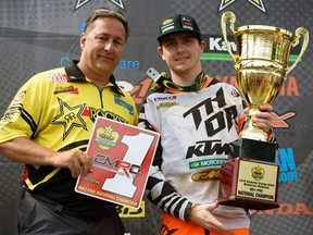 Cole Thompson, right, won the Rockstar Energy Drink MX Nationals MX2 class overall championship this summer by winning seven of 10 races. Thompson received the championship trophy from Canadian Motosport Racing Corp. president Mark Stallybrass. James Lissimore, CMRC Racing/ Handout/Sarnia Observer/Postmedia Network