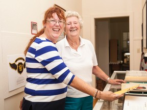 Roberta Raymond, with Joyce Mitz, donates a Vermilion High School 1945-46 yearbook to the Vermilion Heritage Museum on Thursday, August 18. Raymond has been visiting the town in a quest to discover more information regarding her family's genealogy, and donated the yearbook on behalf of her aunt. Taylor Hermiston/Vermilion Standard/Postmedia Network.