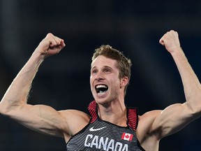 Derek Drouin celebrates winning the Men's High Jump Final during the athletics event at the Rio 2016 Olympic Games. A celebratory parade is planned for Saturday at 11 a.m. in the Olympian's hometown of Corunna.
AFP PHOTO / FRANCK FIFE/Getty Images)