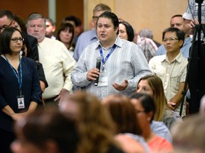 Canadian Union of Postal Workers national president Mike Palecek asks a question during Canada Post's annual public meeting on Friday, Aug. 19, 2016 in Ottawa. (THE CANADIAN PRESS/Justin Tang)