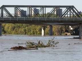 Debris flows along the North Saskatchewan River near the Low Level Bridge as water levels rise in the river in Edmonton, Alberta on Wednesday, Aug. 24, 2016. Ian Kucerak / Postmedia