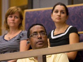 Keith Charles, who operates unregulated group homes through People Helping People, listens as a former tenant of his addresses the Community and Protective Services Committee on Tuesday August 23, 2016. (Free Press file photo)