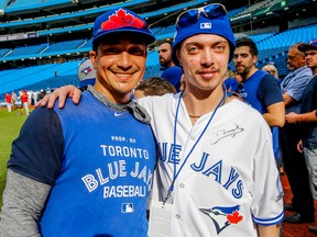 Jonathan Mudryk, 23, meets Blue Jays' Darwin Barney during batting practice at Rogers Centre on Wednesday, August 24, 2016. (Dave Thomas/Toronto Sun)