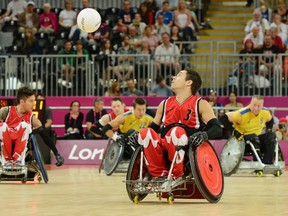 Patrice Dagenais and Ian Chan of Team Canada take on Team Sweden in Wheelchair Rugby at the London 2012 Paralympic Games in the Basketball Arena. Photo by Matthew Murnaghan/Canadian Paralympic Committee