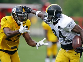 Pittsburgh Steelers wide receiver Antonio Brown gets past cornerback Artie Burns during training camp in Latrobe, Pa., on Aug. 1, 2016. (AP Photo/Gene J. Puskar)