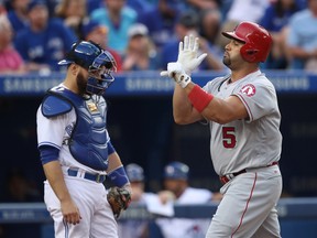 Albert Pujols #5 of the Los Angeles Angels of Anaheim celebrates after hitting a solo home run in the first inning during MLB game action against the Toronto Blue Jays on August 24, 2016 at Rogers Centre in Toronto, Ontario, Canada. (Photo by Tom Szczerbowski/Getty Images)