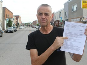 Trent Hills Hector Macmillan stands on the main street in Campbellford with a letter from the Ministry of Health and Long Term Care denying him access to out of country health care. Macmillan is accusing the provincial government of premeditated murder after the government denied his request for out of country health service. Macmillan has been diagnosed with pancreatic cancer and his doctor says he will die before Christmas.
Pete Fisher/Northumberland Today/Postmedia Network