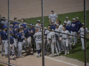 Image shows Toronto Maple Leafs and London Majors players milling about during a bench-clearing dispute in the fourth inning of Wednesday night?s Intercounty Baseball League semifinal playoff game at Christie Pits. The Majors walked off the field, alleging a racial slur took place as the Leafs led 4-1 at the time.(Dan Hamilton/Vantage Point Studios)