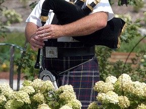 Tom Rankin plays the bagpipes at a reception held at Greenhill Gardens, near Wilkesport. David Gough/Postmedia Network