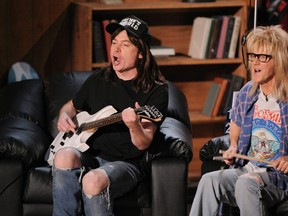 Mike Myers, left, and Dana Carvey, of "Wayne's World" are seen on stage at the MTV Movie Awards on Sunday June 1, 2008 in Los Angeles. Party time, excellent: The film "Wayne's World" turns 25 next year and creator Myers says he wouldn't be against revisiting the titular character again. THE CANADIAN PRESS/AP/Mark J. Terrill