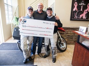 Remax Praire Realty Broker Shawn Jacula presents Holly and Bruce Johnson with a $2,000 cheque to go towards their Motorcycle for Miracles event, which aims to raise money for the Children's Miracle Network on Monday, August 22. Taylor Hermiston/Vermilion Standard/Postmedia Network.