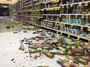 Items fallen from the shelves litter the aisles inside a Safeway grocery store. (Vincent Nusunginya via the AP)