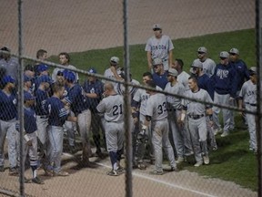 Image shows Toronto Maple Leafs and London Majors players milling about during a bench-clearing dispute in the fourth inning of Wednesday night?s Intercounty Baseball League semifinal playoff game at Christie Pits. The Majors walked off the field, alleging a racial slur took place as the Leafs led 4-1 at the time.(Dan Hamilton/Vantage Point Studios)