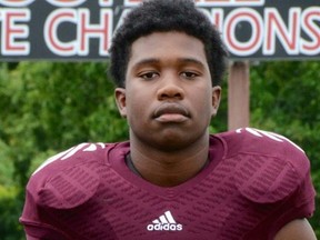 This undated photo released by the Knox County Schools, high school football player Zaevion Dobson, 15, was shot to death on Dec. 17, 2015, in Knoxville, Tenn., as he shielded three girls from gunfire in a shooting spree. Dobson, a sophomore at Fulton High School in northern Knoxville, was “a fine, fine young man,” said Fulton High School football coach Rob Black. (Knox County Schools via AP)