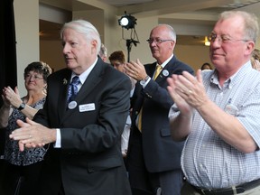 Emily Mountney-Lessard/The Intelligencer 
Our TMH co-chairperson John Smylie (back) reacts during an announcement made at Trenton Memorial Hospital on Thursday in Trenton. Also shown are Our TMH chairman Mike Cowan (right) and Roger McMurray, Brighton councillor.